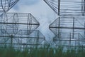 Radio astronomy observatory radio telescope construction in the fields in early spring in cloudy weather