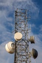Radio communcations tower isolated against a blue sky Royalty Free Stock Photo
