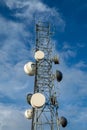 Radio communcations tower isolated against a blue sky Royalty Free Stock Photo