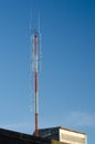 A radio communications tower against blue sky Royalty Free Stock Photo