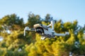 Radio controlled drone hangs in air and takes photo or video. Royalty Free Stock Photo