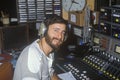 Radio disc jockey for station KFI in his studio, Los Angeles, CA Royalty Free Stock Photo