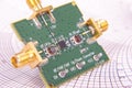 Radio frequency mixer PCB in front of Smith chart Royalty Free Stock Photo