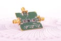 Radio frequency mixer PCB in front of Smith chart Royalty Free Stock Photo