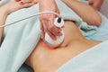 Radio frequency skin tightening, belly. Royalty Free Stock Photo