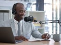 Radio host, black man and networking with laptop, smile and writing for interview, speaking and business influencer Royalty Free Stock Photo