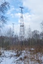 Radio tower in the winter forest. Russia. Royalty Free Stock Photo