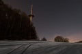 Radio mast in Liebersberg near Grafenau in a full moon winter night, Bavarian forest, Germany Royalty Free Stock Photo