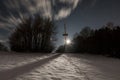 Radio mast in Liebersberg near Grafenau in a full moon winter night, Bavarian forest, Germany