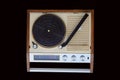 Radio phonograph. Turntable platter, tonearm, AM radio dial, buttons, switches. Royalty Free Stock Photo