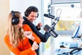 Radio presenters in radio station on air Royalty Free Stock Photo