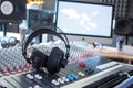 Radio station: Headphones on a mixer desk in an professional sound recording studio Royalty Free Stock Photo