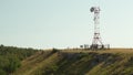 The radio station is in the mountains. The tower is installed for data transmission in the mountains. Royalty Free Stock Photo