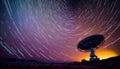 Radio telescope antenna radio receiver on beautiful night sky with star trails copy space Royalty Free Stock Photo