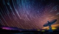 Radio telescope antenna radio receiver on beautiful night sky with star trails copy space Royalty Free Stock Photo