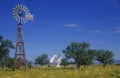 Radio telescope and old windmill at the National Radio Astronomy Observatory in Socorro, NM Royalty Free Stock Photo