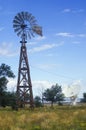 Radio telescope and old windmill at the National Radio Astronomy Observatory in Socorro, NM Royalty Free Stock Photo