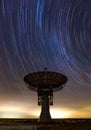 Radio telescope and star trails Royalty Free Stock Photo