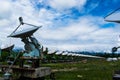 Radio telescope station in the woods during the day