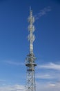 Radio tower against the sky and clouds Royalty Free Stock Photo