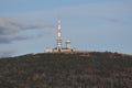 Radio tower and buildings on the Brocken mountain top under the blue sky Royalty Free Stock Photo