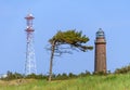 Radio tower, lighthouse and wind swept pine Royalty Free Stock Photo