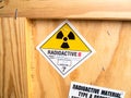 Radiation label beside the transport wooden box Type A package