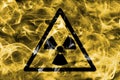 Radioactive substances or ionising radiation hazard warning smoke sign. Triangular warning hazard sign, smoke background. Royalty Free Stock Photo