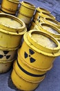 Radioactive warning symbol on yellow tuns of toxic