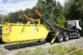 Radioactive waste storage container loading on a truck crane