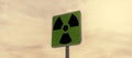 a Radioactivity and chemical hazard street sign with toxic clouds on the background: pollution and danger concept