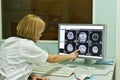 Radiologist analyzing x-ray image