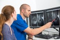 Radiologist councelling a patient using images from tomograpy or MRI