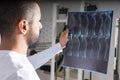 Doctor analysing X-ray image of spine Royalty Free Stock Photo