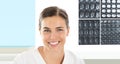 Radiologist woman smiling with xray in background