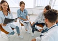 radiologists and a surgeon discussing a radiograph of a patient