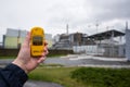 Radiometer in hand with fourth reactor on the background