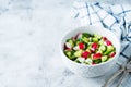 Radish cucumber salad with greens in bowl Royalty Free Stock Photo