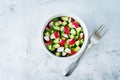 Radish cucumber salad with greens in bowl Royalty Free Stock Photo