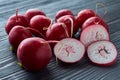 Radish root vegetables lie on a black wooden table Royalty Free Stock Photo