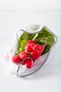 Radish vegetable in reusable mesh nylon bag, plastic free zero waste concept Royalty Free Stock Photo