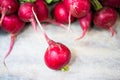 Radishes lie on each other on wooden ground Royalty Free Stock Photo