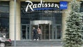 Radisson Blu Olympiyskiy Hotel. Hotel entrance with revolving doors by a gateway