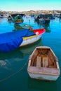 raditional eyed colorful boats Luzzu in the Harbor of Mediterranean fishing village