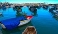 raditional eyed colorful boats Luzzu in the Harbor of Mediterranean fishing village