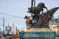 Radium Hot Springs, British Columbia, Canada - Janurary 20, 2019: A confused bighorn sheep baby ewe stands on top of a statue of