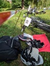 Mountainbikes laying in the grass before the start in depot