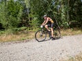 Race veteran join mtb hobby race and ride downhill from forest