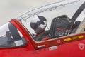 Royal Air Force Pilot prepares for takeoff in the cockpit of a Red Arrows British Aerospace Hawk T.1 jet trainer aircraft.