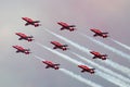 Royal Air Force RAF Red Arrows formation aerobatic display team flying British Aerospace Hawk T.1 Jet trainer aircraft. Royalty Free Stock Photo